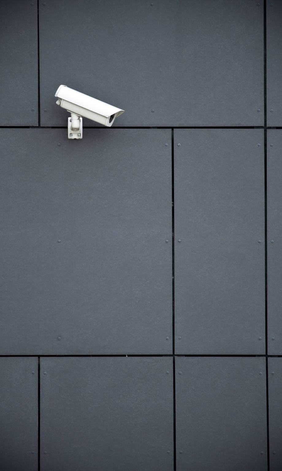 Security camera on dark modern building